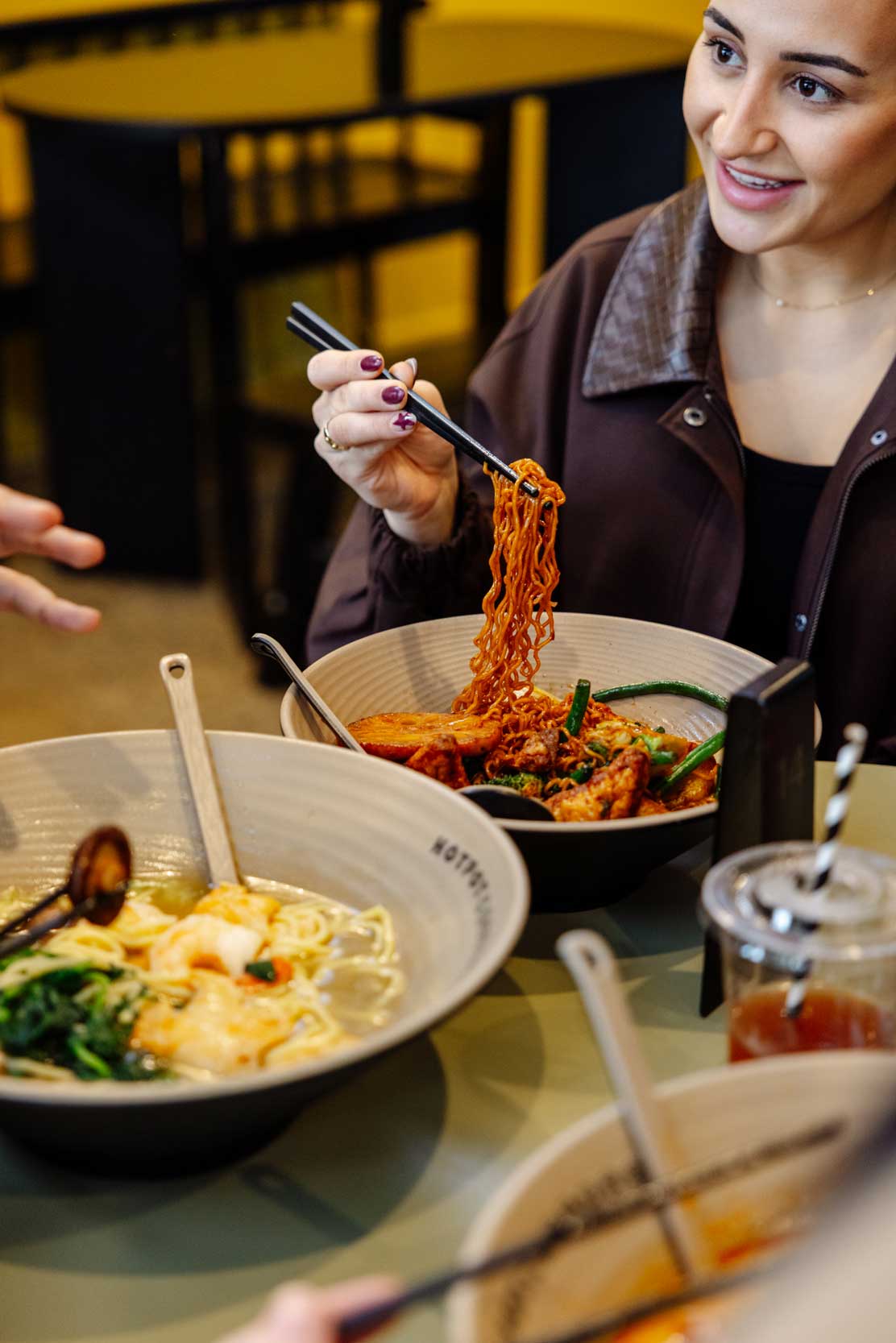Fresh noodles twirled over a hotpot bowl.