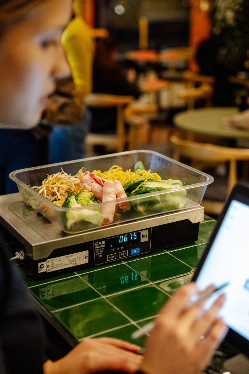 A tray of ingredients being weighed at the counter before cooking.